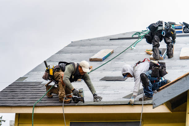 Professional Storm Damage Roof Repair technician working in Raymond, NH
